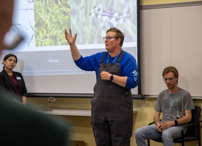 Appears to be Oakton's Naturalist presenting during a meeting.