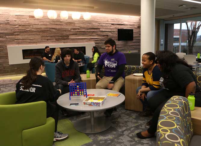 A group of students at Oakton College's Student Center playing board games.