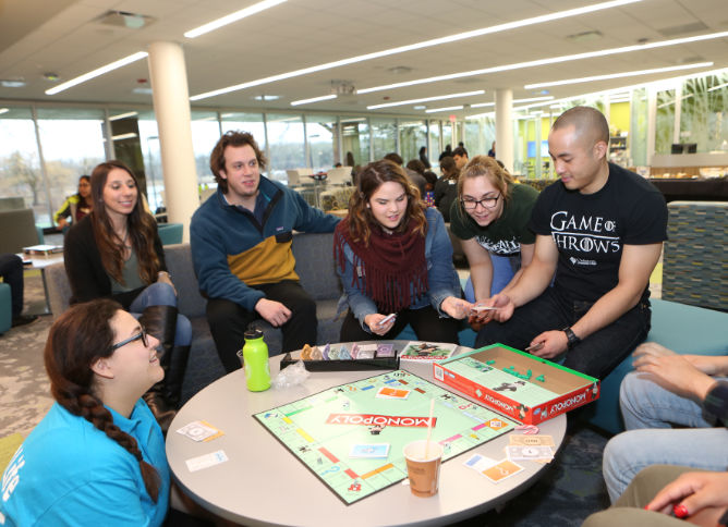 A group of students playing a board game