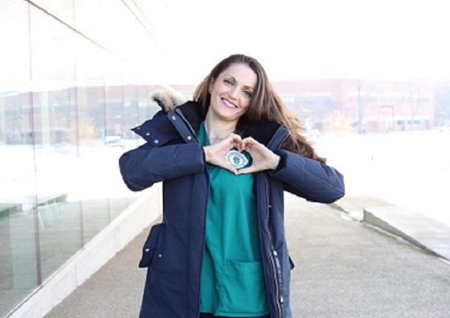 Elena Gavriliuc displays her joy of being an Oakton nursing graduate