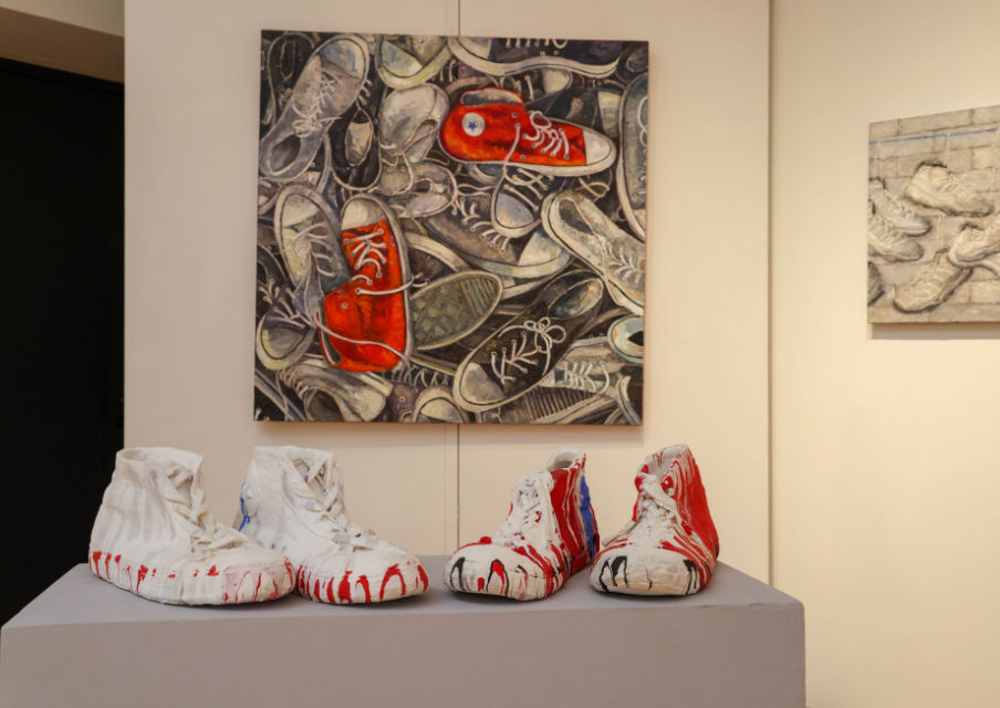 A photo of painted shoes from Patrick Miceli's Played Out exhibit at Oakton College.